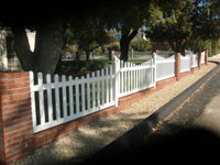 Vinyl picket fence with brick wall & columns